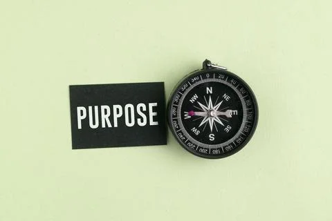 A compass with the word PURPOSE. Purpose Concept: Finding Life Direction, B.. Stock Photos