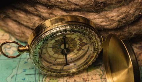 Compass on the world map compass lies on an ancient world map Copyright: x... Stock Photos
