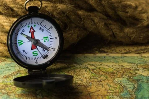 Compass on the world map compass lies on an ancient world map Copyright: x... Stock Photos