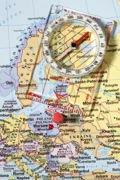 Compass on world map Stock Photos