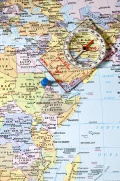 Compass on world map Stock Photos