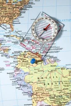 Compass on world map Stock Photos