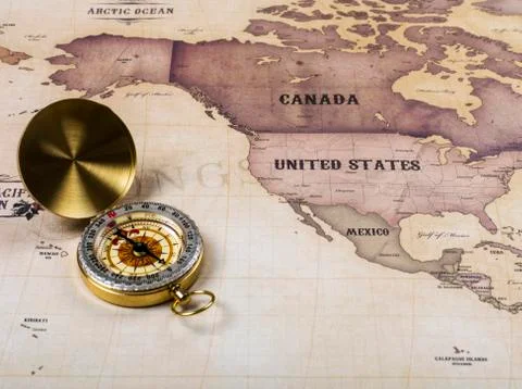 Compass with world map Stock Photos