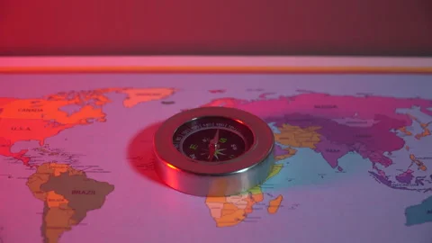 Compass on the world map under the red light Stock Footage 305000907