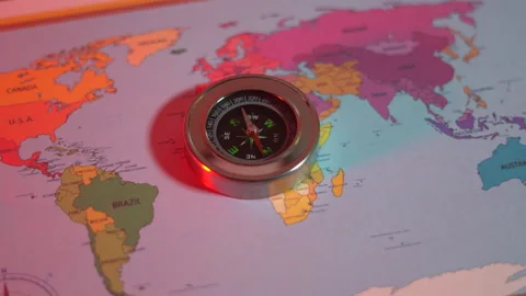 Compass on the world map under the red light Stock Footage 305000925