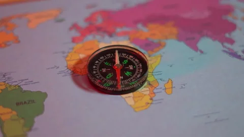 Compass on the world map under the red light Stock Footage 305001078