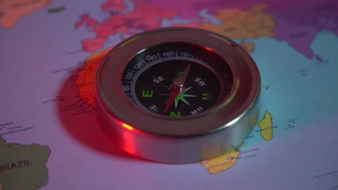 Compass on the world map under the red light Stock Footage 305001153
