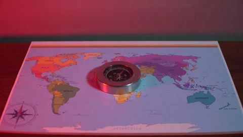 Compass on the world map under the red light Stock Footage 305001189