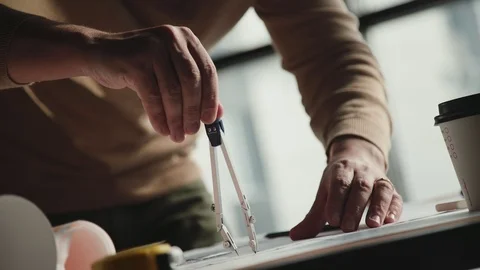 The compasses are in the hands of an architect or an engineer. Stock Footage 87116458