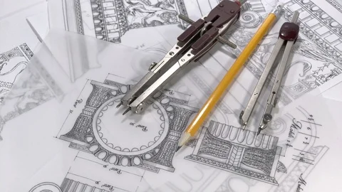 Compasses rotate slowly in the drawings of elements of ancient architecture Stock Footage 93903724