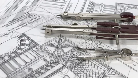 Compasses rotate slowly in the drawings of elements of ancient architecture Stock Footage 93903836