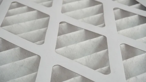 Compering Dirty and Clean Air Filters to See how much Dust it Gets Stock Footage 98618424