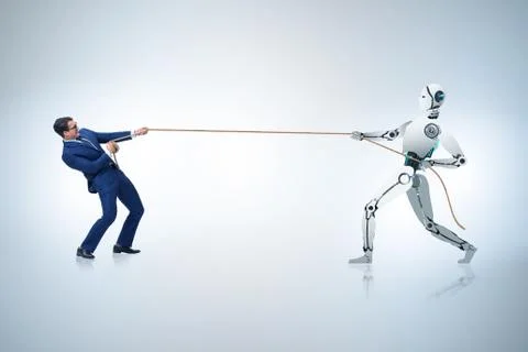 Competition between humans and robots in tug of war concept 스톡 사진
