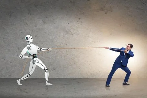 Competition between humans and robots in tug of war concept 스톡 사진