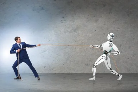 Competition between humans and robots in tug of war concept Stock Photos