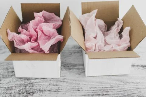 Competition concept, delivery parcel boxes side by side with slightly differe Stock Photos