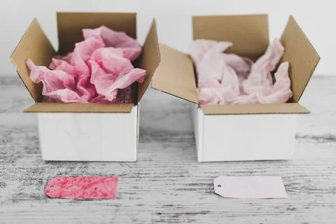 Competition concept, delivery parcel boxes side by side with slightly differe Stock Photos