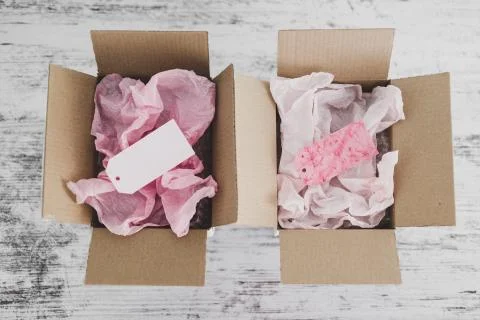 Competition concept, delivery parcel boxes side by side with slightly differe Stock Photos