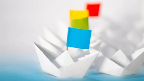 Competition concept using Origami paper boats. To strive against another. Stock Photos