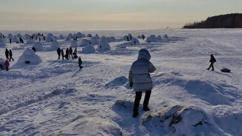 Competition for the construction of an igloo from snow bricks Stock Footage 302733010