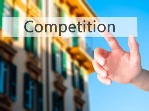 Competition - Hand pressing a button on blurred background concept on visual  Stock-Fotos