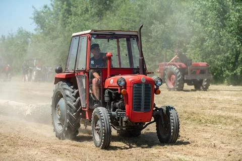 Competition in log pulling with tractors Stock Photos