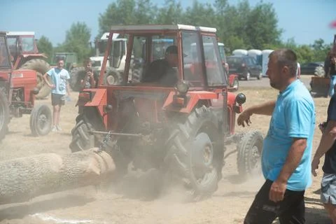 Competition in log pulling with tractors Stock Photos