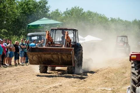 Competition in log pulling with tractors Stock Photos