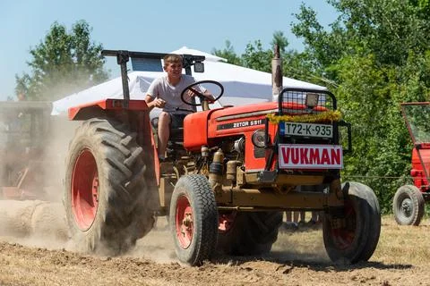 Competition in log pulling with tractors Stock Photos