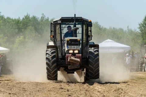 Competition in log pulling with tractors Stock Photos
