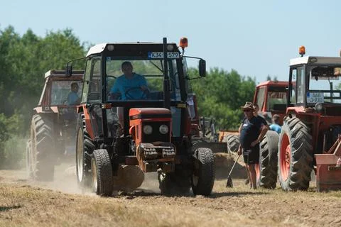 Competition in log pulling with tractors Stock Photos