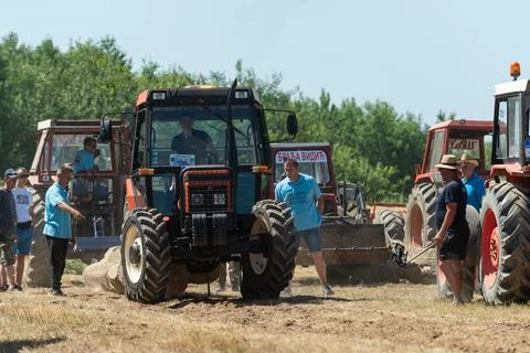 Competition in log pulling with tractors Stock Photos