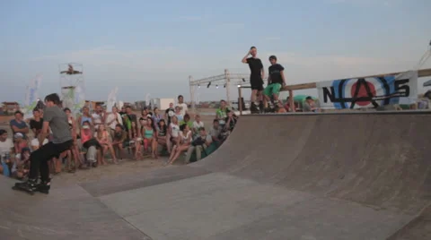 Competition of Rollerskating in Minirampe. Young Boy Riding on Roller Skates Stock Footage 59895825