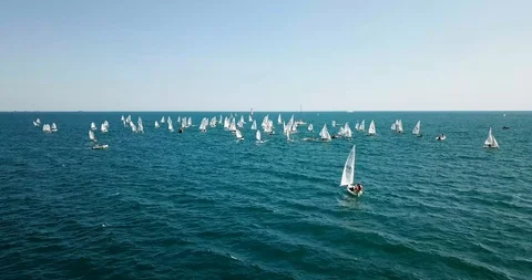 Competition on small yachts under sail on the Black Sea in Novorossiysk. Aerial Stock Footage 121487872