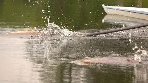 Competitions in rowing. Paddle in the water. Water splashes. Slow motion. Video stock 77145846