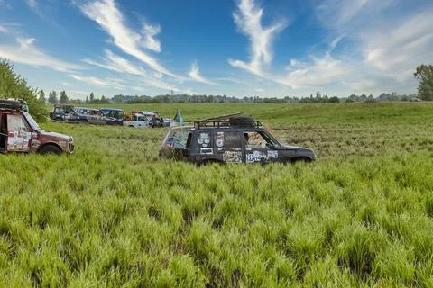 Competitions taking place in difficult terrain on 4x4 off-road vehicles Stock Photos