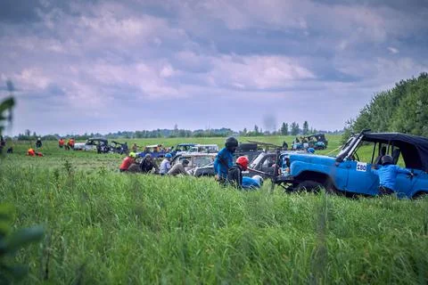 Competitions taking place in difficult terrain on 4x4 off-road vehicles Stock Photos