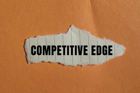 Competitive Edge message written on ripped torn paper background. Conceptua.. Foto stock