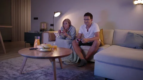 Competitive Focused Couple Push And Shove Each Other As They Play Video Games At Stock Footage 135741082