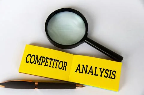 Competitor analysis text on yellow notepad with pen and magnifying glass Stock Photos