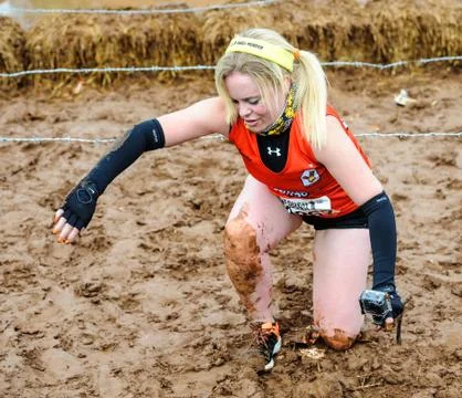 A competitor taking part in a Tough Mudder extreme sport event at Drumlanrig  Stock Photos