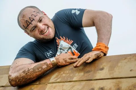 A competitor taking part in a Tough Mudder extreme sport event at Drumlanrig  Stock Photos