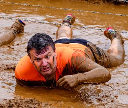 A competitor taking part in a Tough Mudder extreme sport event at Drumlanrig  Stock Photos