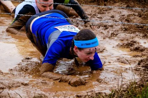 A competitor taking part in a Tough Mudder extreme sport event at Drumlanrig  Stock Photos
