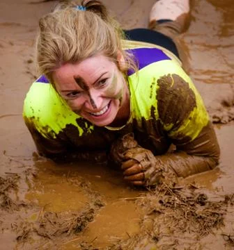A competitor taking part in a Tough Mudder extreme sport event at Drumlanrig  Stock Photos