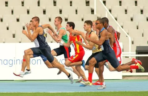 Competitors on start of 100m of Decathlon Stock Photos
