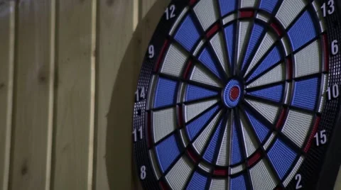 Competitors throw at target with blue and pink arrows 6 Stock Footage 60029877