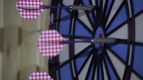 Competitors throw at target with blue and pink arrows Stock Footage 60029937