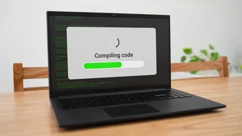 Compiling code with green progress bar. Concept of a programmer working and Video stock 310318189