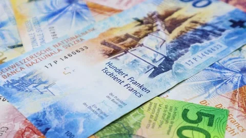 A complete 360 degree orbit of Swiss Franc currency notes Stock Footage 271685320